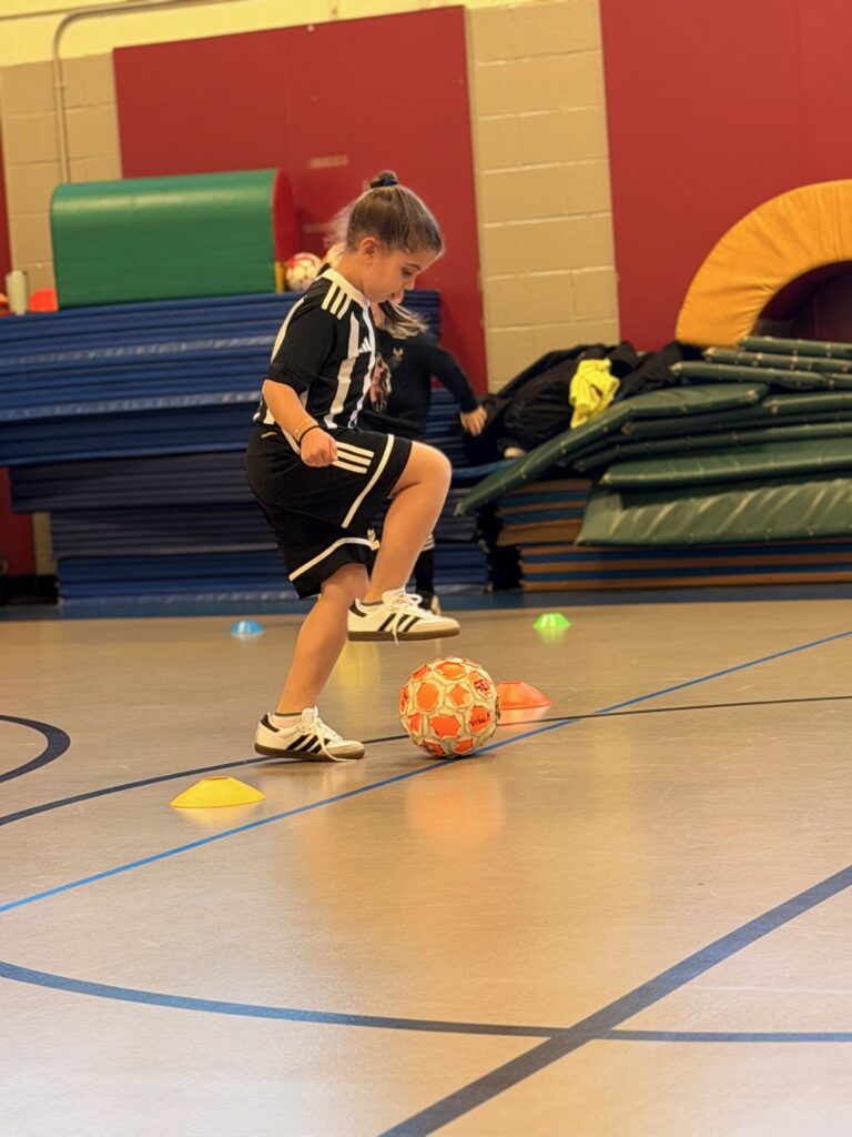 A futsal player working on close ball control