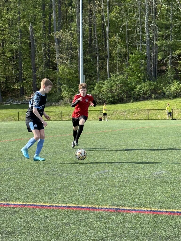 BAC travel player on the ball during a match