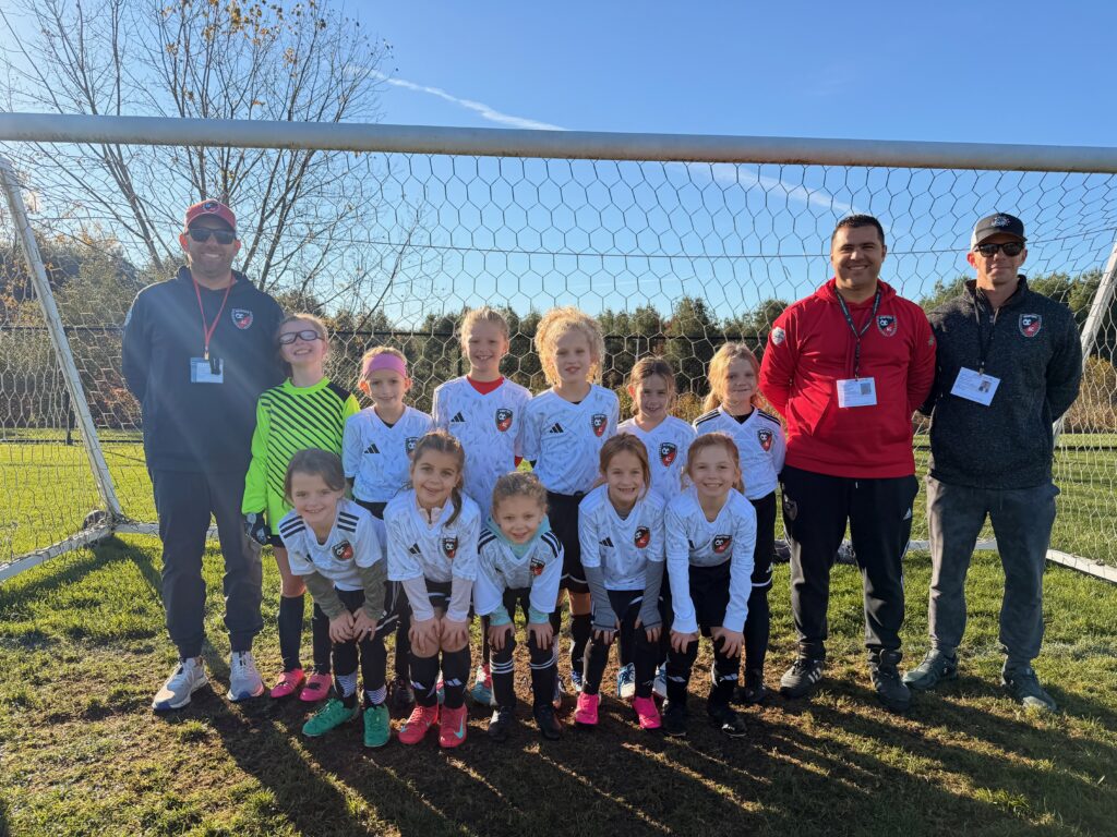 Young BAC travel team with coaches