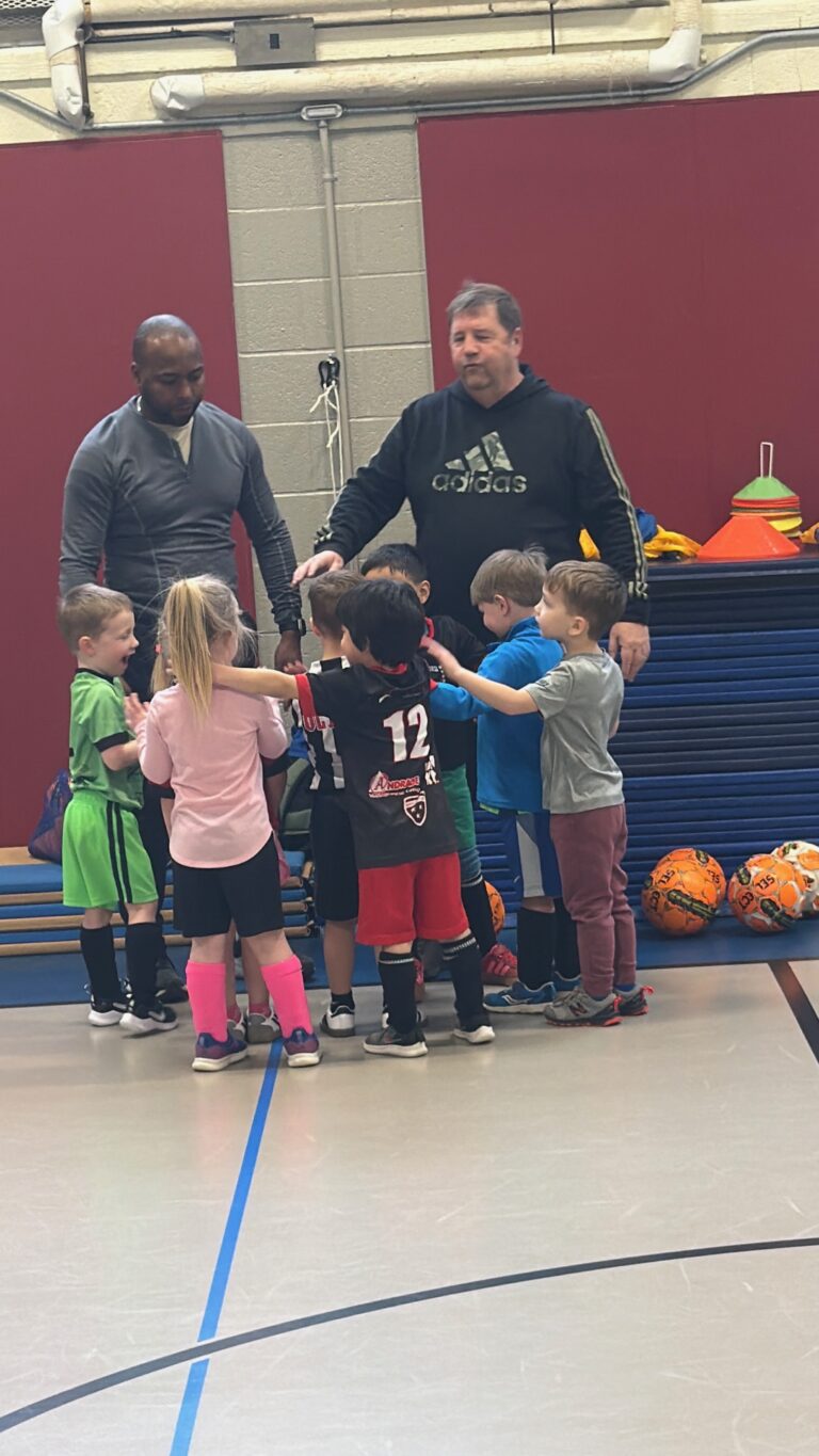 Futsal players and coaches at the Memorial Elementary gym